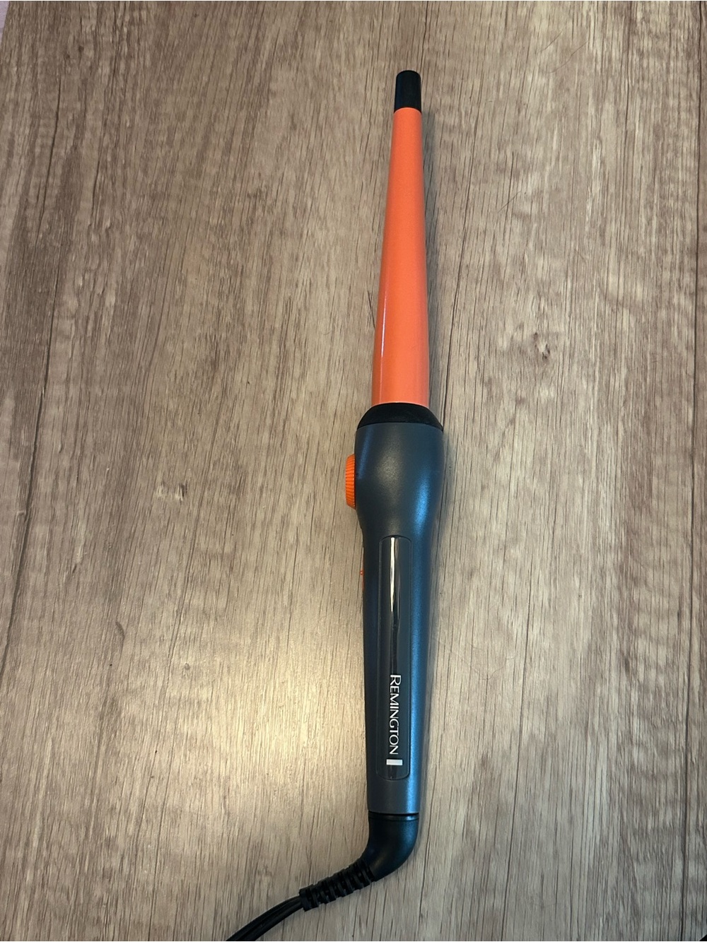 Remington curling iron and protective glove. Like new condition.